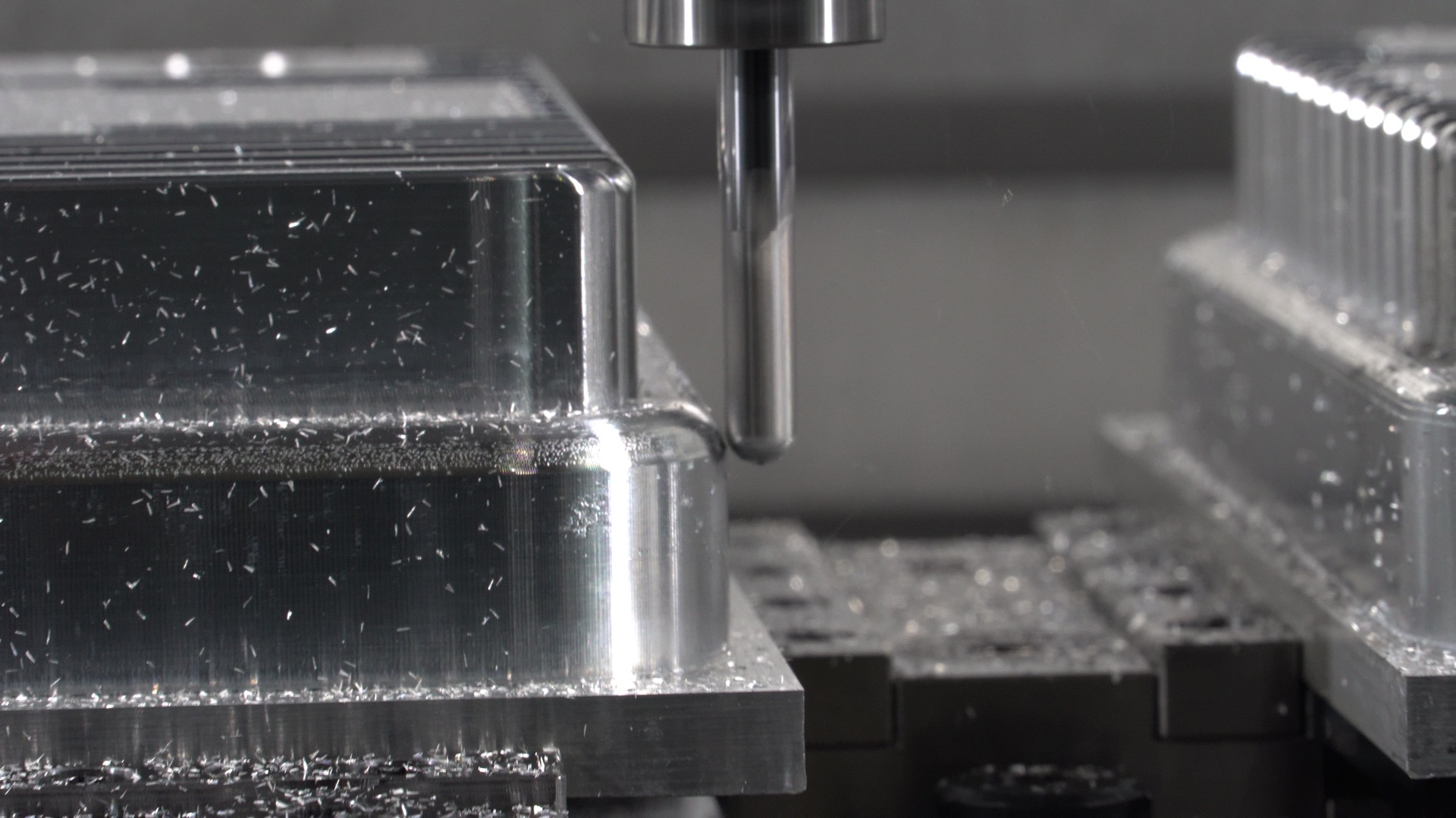 Cutting tool machining aluminium on a three-axis CNC mill