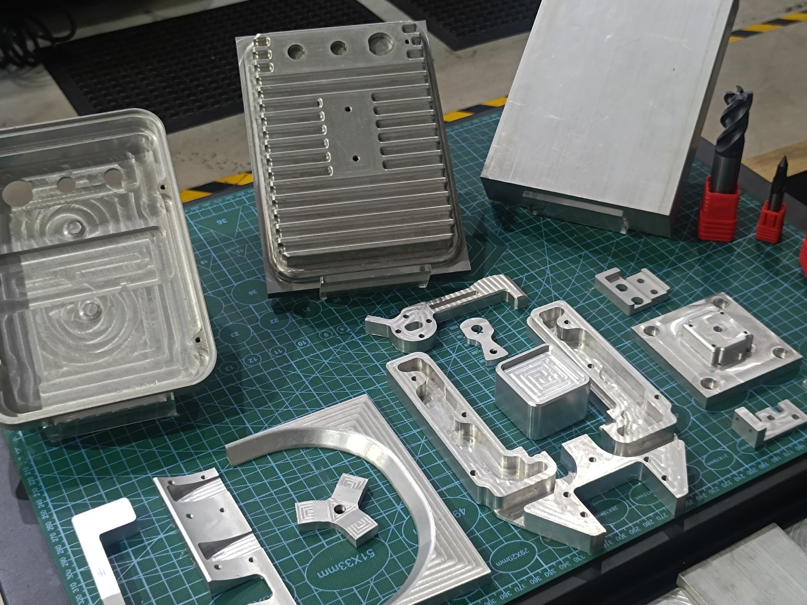 Collection of custom CNC milled aluminium moulds, brackets and components made in Sri Lanka